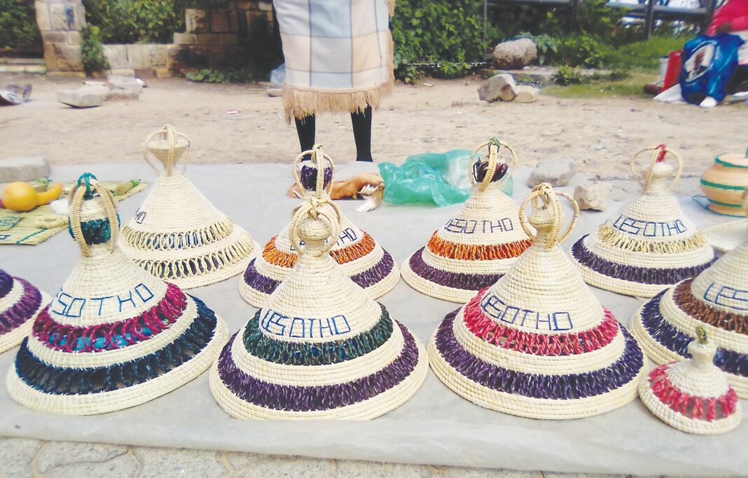 Mohale weaves Basotho hats